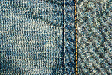 clothing items blue stonewashed faded jeans cotton fabric texture with seams, clasps, buttons and...
