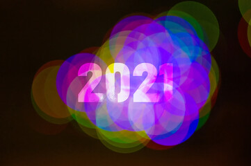 Christmas background-garlands with colorful lights on a decorated Christmas tree, bokeh