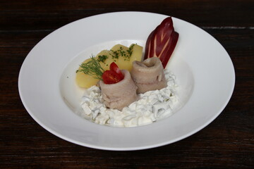 Variations of herring Salad and fillets. Served with parsley potatoes