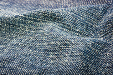 clothing items blue stonewashed faded jeans cotton fabric texture with seams, clasps, buttons and...