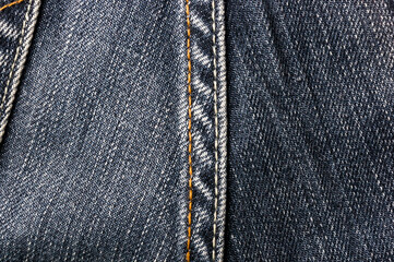 clothing items blue stonewashed faded jeans cotton fabric texture with seams, clasps, buttons and...