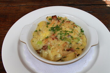Potato casserole with bacon, close-up