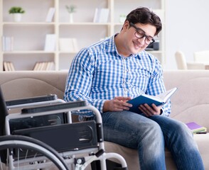 Young student on wheelchair in disability concept