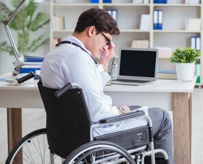 Disabled doctor on wheelchair working in hospital
