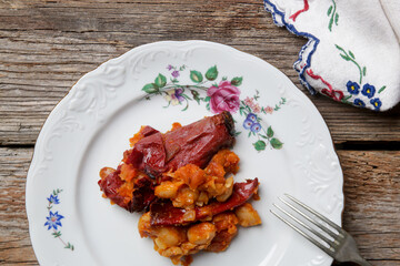 Homemade stuffed roasted red peppers with beans. Tavche gravche traditional Macedonian dish.