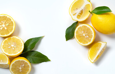 Lemons placed on a white background with copy space and cut in half