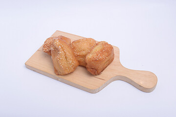 Pillow breads on cutting board