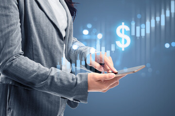 Businesswoman with mobile phone showing a dollar virtual bar chart