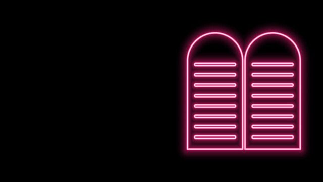 Glowing neon line The commandments icon isolated on black background. Gods law concept. 4K Video motion graphic animation