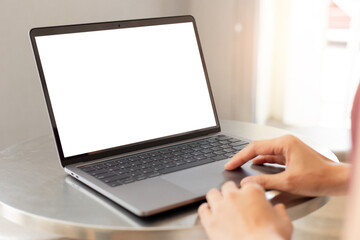 computer screen blank mockup.hand woman work using laptop with white background for advertising,contact business search information on desk at coffee shop.marketing and creative design