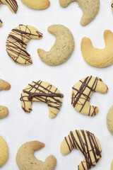 Small walnut, almond and chocolate crescent cookies