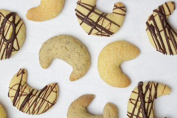 Small walnut, almond and chocolate crescent cookies