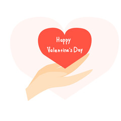 Hands hold a red heart with the inscription Happy Valentine's Day. 
