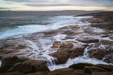 waves breaking on the rocks
