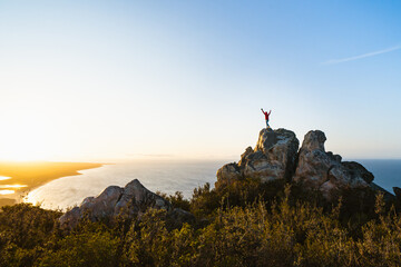 Lone man standing on the top of East Mount Barren as the sun rises behind him. Located in the Fitzgerald River National Park in Hopetoun, Western Australia.  © Sky Perth