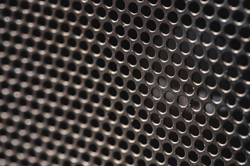 Speaker grill texture is black with dust particles