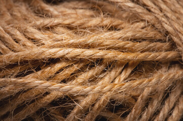 Natural rope twine textured background close up plan. Fibers in a mess rustic style