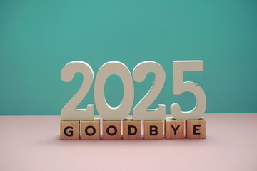 Goodbye 2025 alphabet letter on blue and pink background