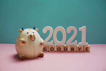 Goodbye 2021 alphabet letter on blue and pink background