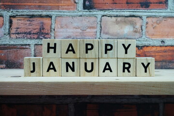 Happy January alphabet letter on shelves wooden background