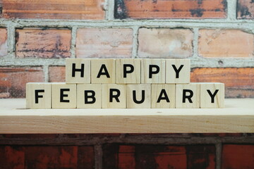 Fototapeta premium Happy February alphabet letter on shelves wooden background
