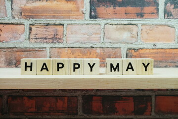 Happy May alphabet letter on shelves wooden background