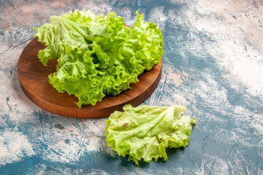 front view fresh green salad on light-blue background photo ripe salad color