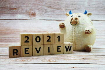 REVIEW 2021 alphabet letter on wooden background