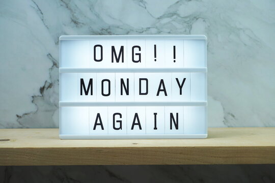 Monday Again word in light box on marble and wooden shelves background