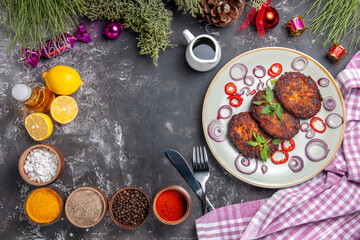 top view yummy cutlets with onion rings on the light-grey background meal photo meat dish