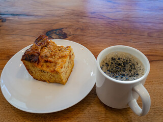 Close up shot of a cake and a coffee