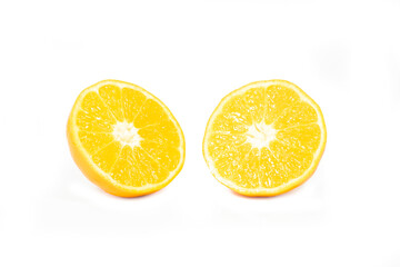 Orange fruit cut in half on a white background