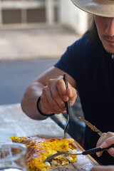 Men eating a cachapa