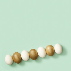 Top view easter composition with white and golden eggs, creative spring holiday flat lay with painted chicken egg