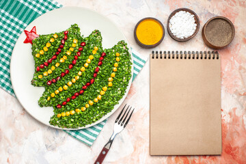 top view tasty green salad in new year tree shape with seasonings on the light background color photo meal holiday health xmas