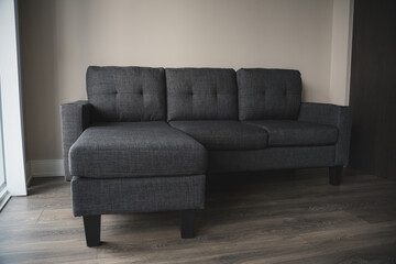Beautiful Minimalistic Grey Sofa in a Living Room