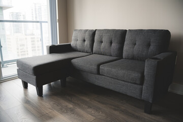 Beautiful Minimalistic Grey Sofa in a Living Room