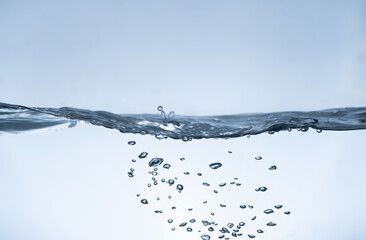 Water splash Aqua flowing in waves and creating bubbles Drops on the water surface feel fresh and clean.