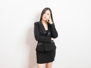 Fototapeta premium Asian business woman with hands on face suffering from severe depression on white background. Unemployment and layoff concept.