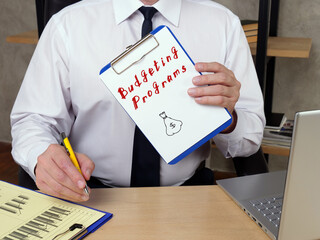 Business concept meaning Budgeting Programs J with inscription on the piece of paper.