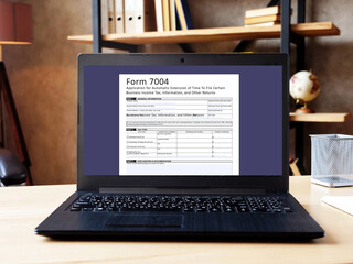 Business concept about  Form 7004 Application for Automatic Extension of Time To File Certain Business Income Tax, Information, and Other Returns  with phrase on the piece of paper.