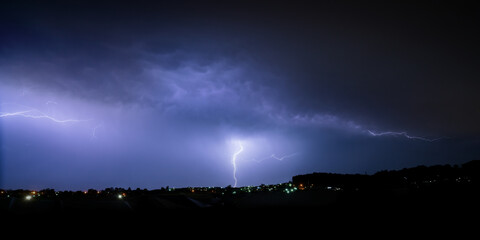 lightning over the city outskirts
