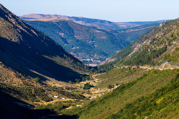 Fototapeta na wymiar Green river Rio Zezere valley mountain panorama landscape on sunset. Portugal, Serra da Estrela
