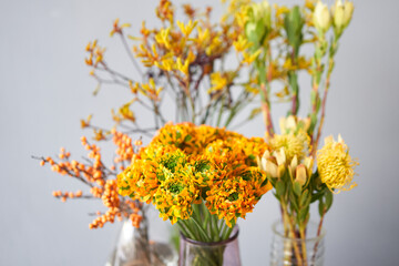 Set of yellow nd orange flowers for Interior decorations. The work of the florist at a flower shop. Fresh cut flower. European floral shop. Delivery fresh cut flower