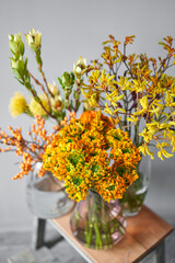 Set of yellow nd orange flowers for Interior decorations. The work of the florist at a flower shop....