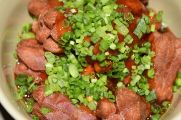 Crispy sausages mixed with tomato sauce, scallions, vegetables and spices, sweet and fragrant, a snack for children or families.