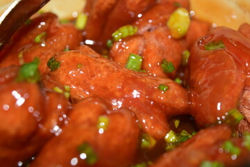 Crispy sausages mixed with tomato sauce, scallions, vegetables and spices, sweet and fragrant, a snack for children or families.