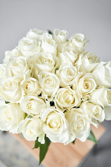 White rose in a vase . Summer background. Bouquet of roses present for Mothers Day. Photo of Flowers for a catalog of flower online store and delivery.