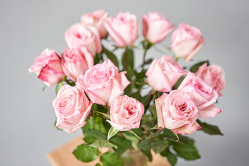 pink rose in a vase . Summer background. Bouquet of roses present for Mothers Day. Photo of Flowers for a catalog of flower online store and delivery.