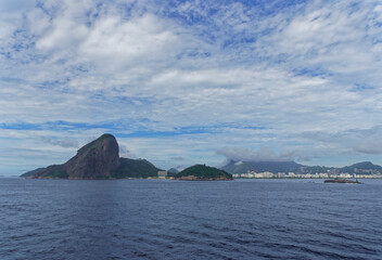 Copacabana beach visible from a Vessel heading in to the Port of Rio, overlooked by the dramatic...
